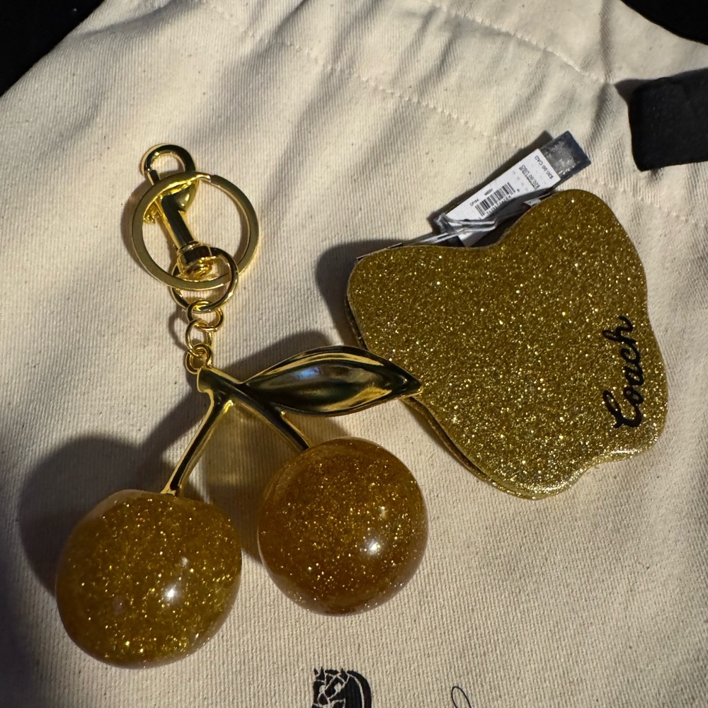 Coach Gold Glitter butterfly mirror and unbranded gold cherry charm